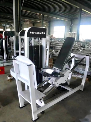 Using Seated Leg Press Machine Steel Pin Load Selection for Fitness Strength Training