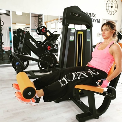 Universal Seated Leg Extension and Leg Curl Pin Load Selection for Strength Training